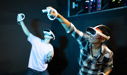 Two people engaged in a virtual reality gaming experience