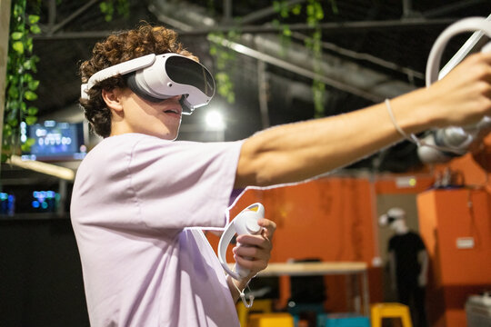 Engaged gamer experiencing virtual reality simulation