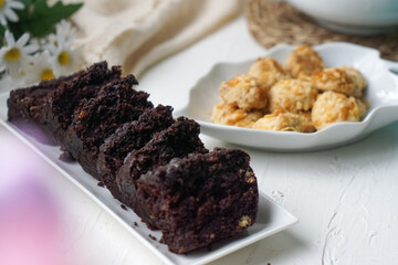 Chocolate moist cake with nuts and cornflakes cookies.