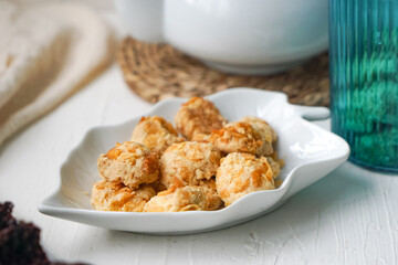 Cornflakes cookies in a white plate. Selective focus.
