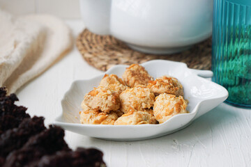 Cornflakes cookies in a white plate. Selective focus.