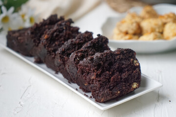 Chocolate moist cake with nuts and cornflakes cookies.