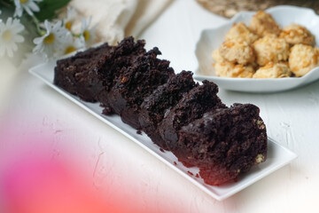 Chocolate moist cake with nuts and cornflakes cookies.