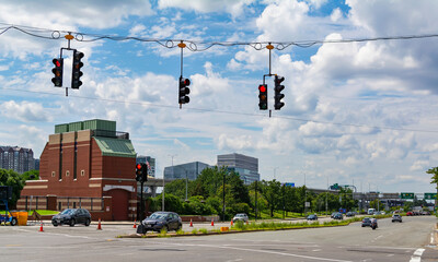 A view of New Rutherford Avenue with span wire traffic lights isolated on sky background in Boston,...