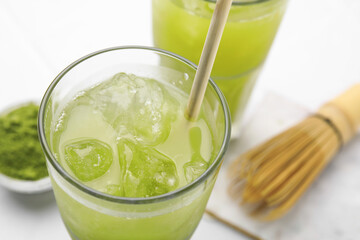 Glass of delicious iced green matcha tea, closeup