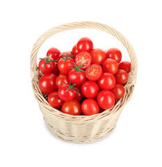 Wicker basket with fresh ripe cherry tomatoes isolated on white