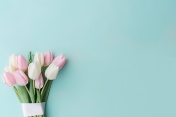 Fototapeta premium Beautiful composition spring flowers. Bouquet of pink white tulips flowers pastel blue background. Valentine's Day, Easter, Birthday, Happy Women's Day, Mother's Day. Flat lay, top view, copy space