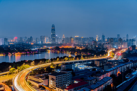 Night view of Daming Lake and city viaduct skyline in Jinan, Shandong, China