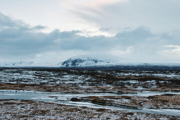 View of the snowy plateau in winter at Thingvellir National Park in Iceland. November 2021 during the Covid 19 Pandemic. On a cold winter morning.