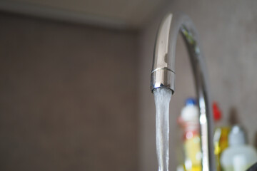 water pouring from a faucet tap slow motion 