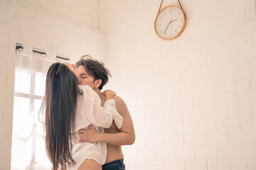 Asian couple having passionate sex in the bedroom. Romantic couple in bedroom. She loves being...