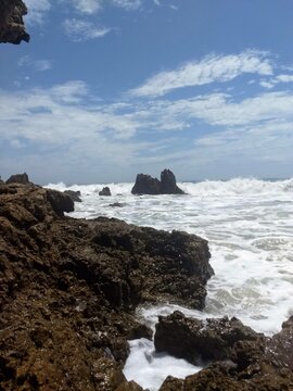 waves crashing on rocks