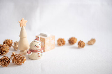 Wooden toy snowman and tree, warm white Christmas