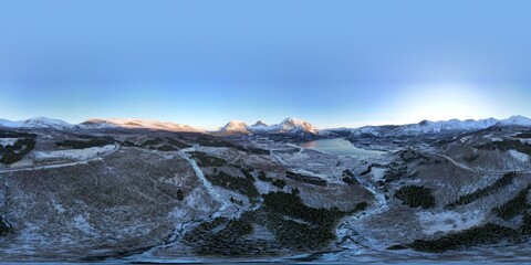 Sunlight kisses the peaks surrounding Norway's fjord