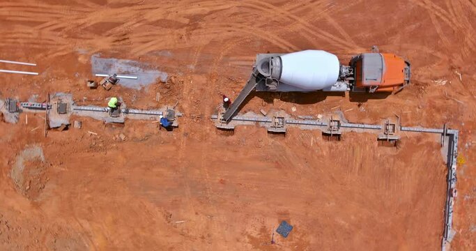 Concrete pouring of foundation columns for building during construction is used concrete mixer truck
