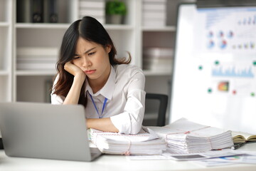 Asian women who are serious about working in the office are stressed by working too hard and...