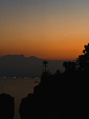 sunset over the sea and the moon
