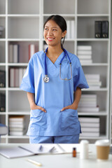 Portrait young Asian female medical student smiling. Doctor's assistant in a clinic office at a...