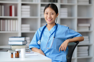 Portrait young Asian female medical student smiling. Doctor's assistant in a clinic office at a hospital.