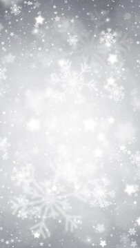 Silver white shining snowflakes with snowfall loop vertical background.