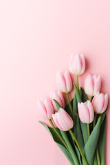 Romantic light pink background with light pink tulip flowers and place for text. Greeting card design for Mother's day, Valentine day, Women's Day. Flat lay Springtime composition with copy space - obrazy, fototapety, plakaty