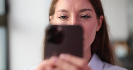 Closeup of woman addicted to smartphone