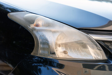 Water droplets remain inside the car headlights. Car problems caused by rainy or water leaked.