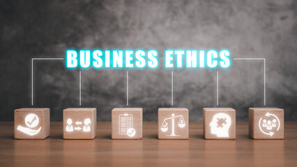 Business ethics concept, Wooden block on desk with business ethics icon on virtual screen.