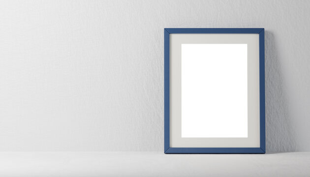 photo frame mockup against neutral plaster background. blue photo frame mockup with blank white sheet on gray shelf. copy space