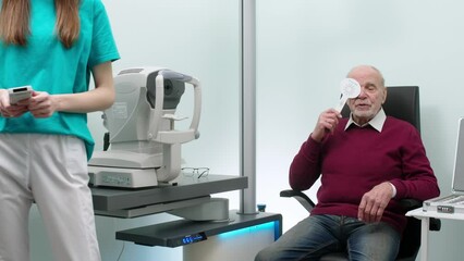 Vision test, diagnostics-consultation for a pensioner, client or patient during a vision test. Ophthalmologist care, optometry services and eye exams. Concept of reviews, advertising of services.