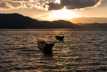 The beautiful scenery of Lugu Lake in China under the setting sun