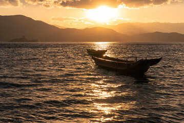 The beautiful scenery of Lugu Lake in China under the setting sun