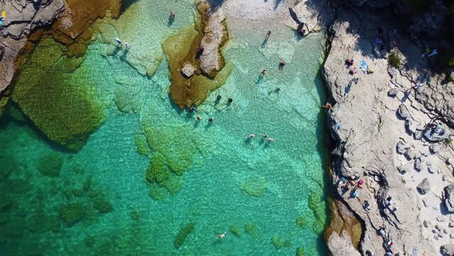 Top View Of Tourists At The Pristine Beach On Flowerpot Island In Georgian Bay, Ontario Canada. Aerial Topdown