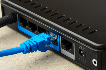 Modern router with cables plugged in close up