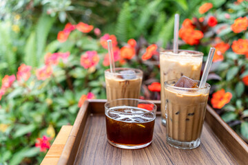 Cold milk coffee cups in Da Lat city, Vietnam style on table. Selective Focus.
