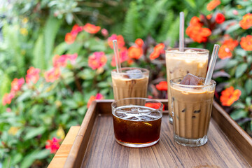 Cold milk coffee cups in Da Lat city, Vietnam style on table. Selective Focus.