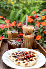 Cold milk coffee cups in Da Lat city, Vietnam style on table. Selective Focus.