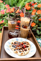 Cold milk coffee cups in Da Lat city, Vietnam style on table. Selective Focus.