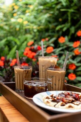 Cold milk coffee cups in Da Lat city, Vietnam style on table. Selective Focus.