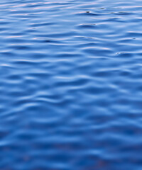 Naklejka premium Reflection​ on surface​ blue​ water​ for​ background. Abstract​ of​ surface​ pink​ water​ for​ background.