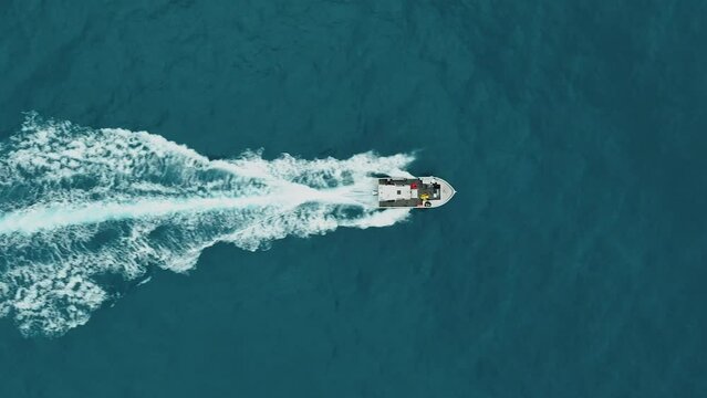Aerial top view following science boat cruising in S&egrave;te, France