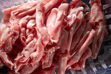Thinly sliced frozen raw meat