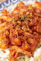 Chili shrimp and salad on a plate