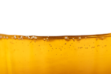 Bubbles in honey, with white background, close-up shot, healthy food
