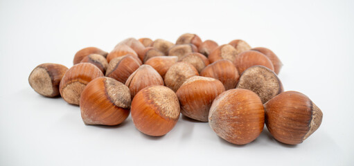 Close up hazelnuts on white background isolated.