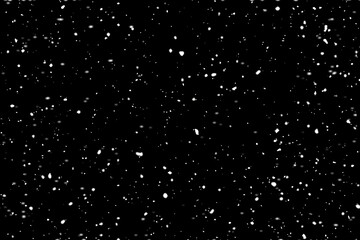 Falling snowflakes on black