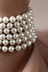 Pearl necklace on beige silk fabric