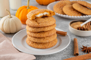Pumpkin cinnamon cookies with cream cheese filling. Pumpkin snickerdoodle cookies. Food for Thanksgiving or Halloween.