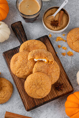 Pumpkin cinnamon cookies with cream cheese filling. Pumpkin snickerdoodle cookies. Food for Thanksgiving or Halloween.