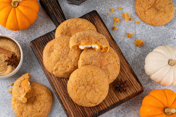 Pumpkin cinnamon cookies with cream cheese filling. Pumpkin snickerdoodle cookies. Food for Thanksgiving or Halloween.